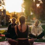 여성 건강관리, ‘마음 챙김’과 ‘소소한 습관’이 변화 이끈다 a group of people sitting on top of a lush green field